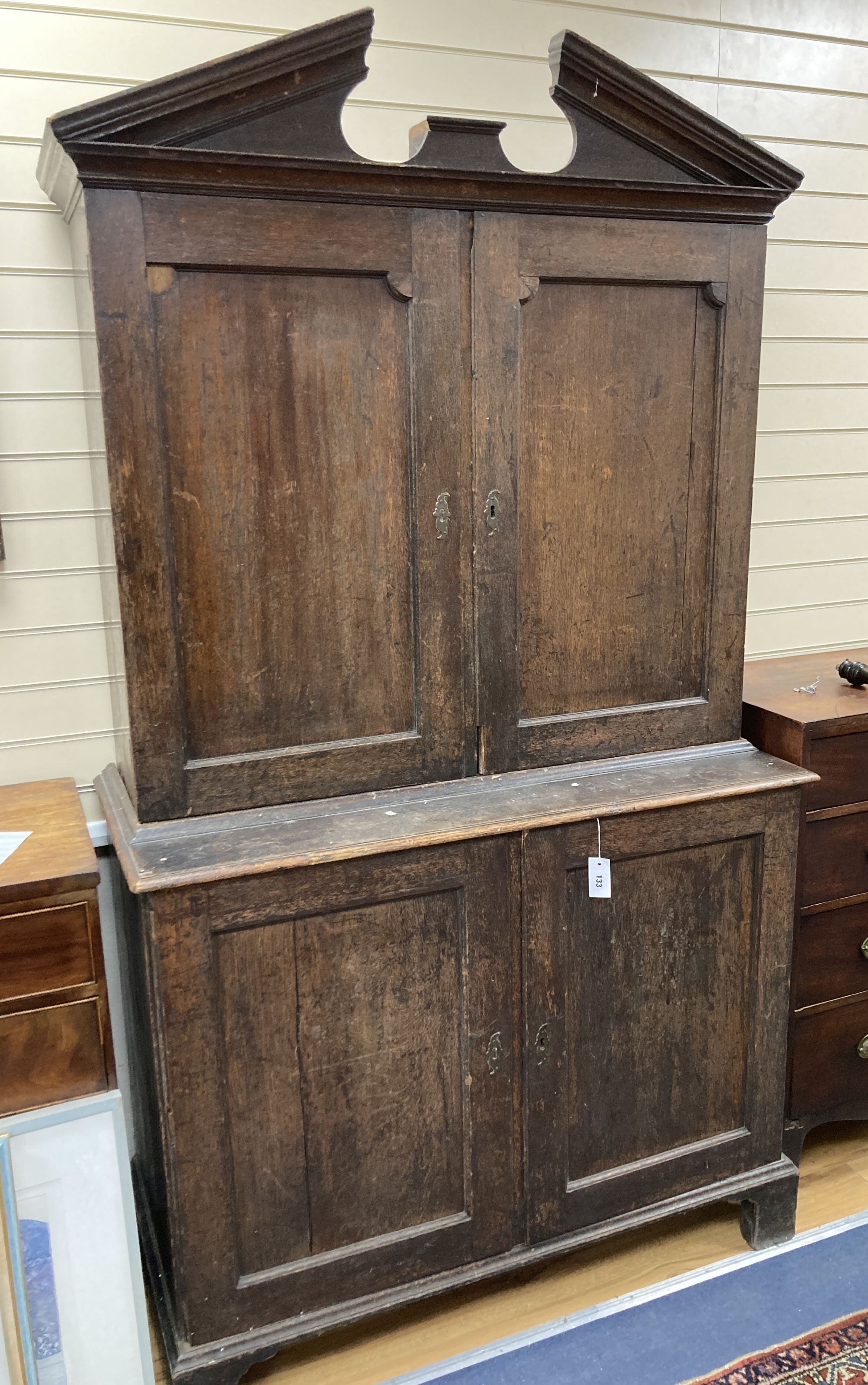 A mid 18th century oak linen press, length 120cm, depth 54cm, height 217cm